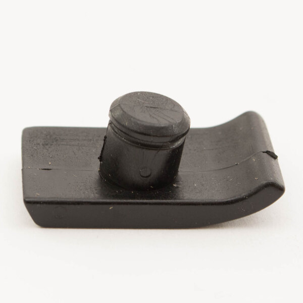A close-up of a black plastic latch clip.