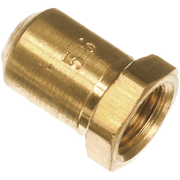 A close-up of a brass nut threaded onto a brass orifice.