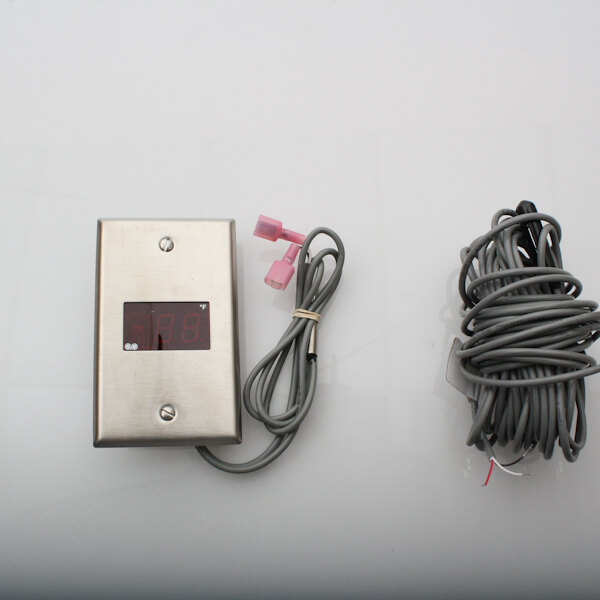 A Kolpak Therm Digital with a wire and cable on a metal surface.