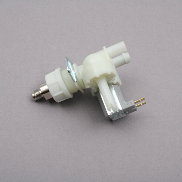 A white plastic Bloomfield solenoid valve with a metal connector.
