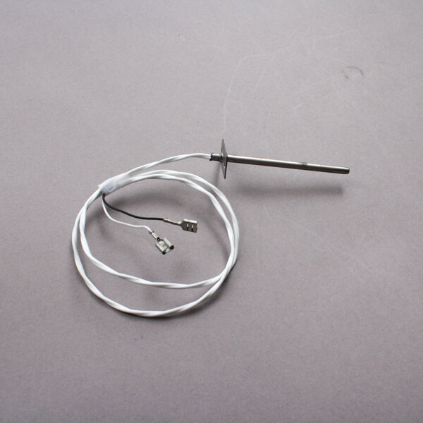 A wire with a metal rod used with a Wells drop-in food warmer.