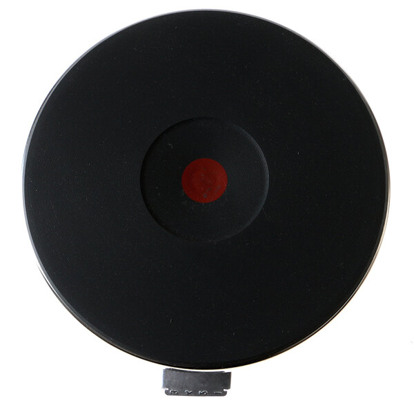 A black circular Lang French plate with a red circle in the center.