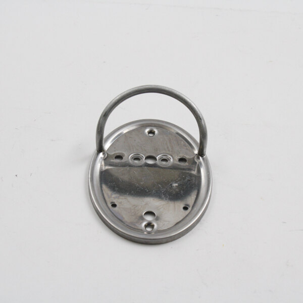 A close-up of a metal Wells 2V-WL0049 panel ring with holes in it.