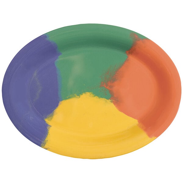 A white oval platter with yellow and green diamond-shaped paint designs.