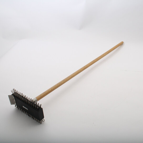 A metal brush with a black and wooden handle.