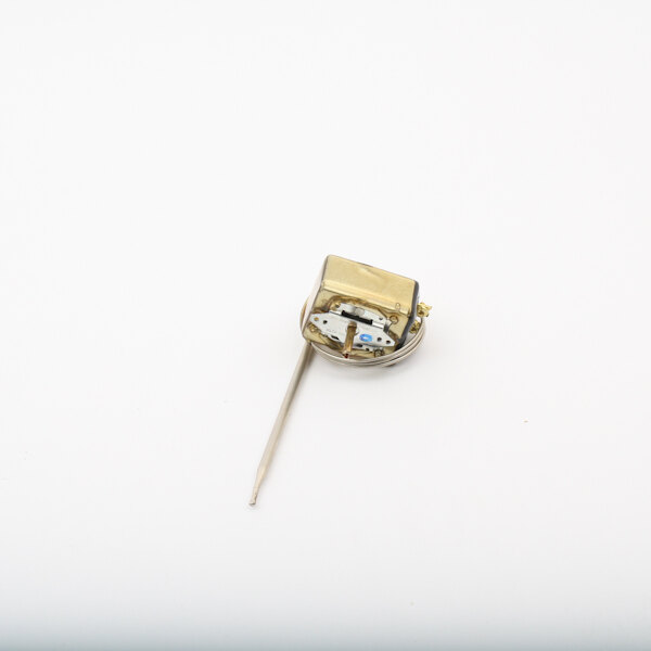 A close up of a small gold pin on a Wittco thermostat.