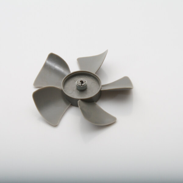 A grey plastic Master-Bilt fan blade.