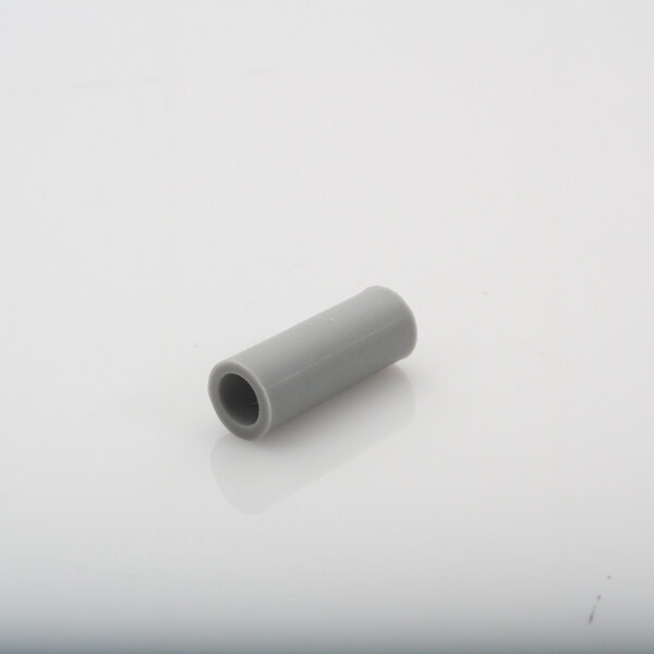 A grey plastic Wilbur Curtis tube extension on a white surface.