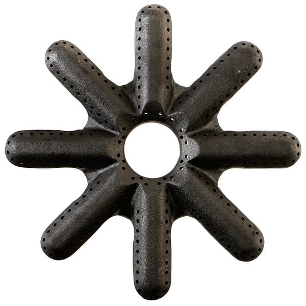 A black US Range burner head with star-shaped holes.