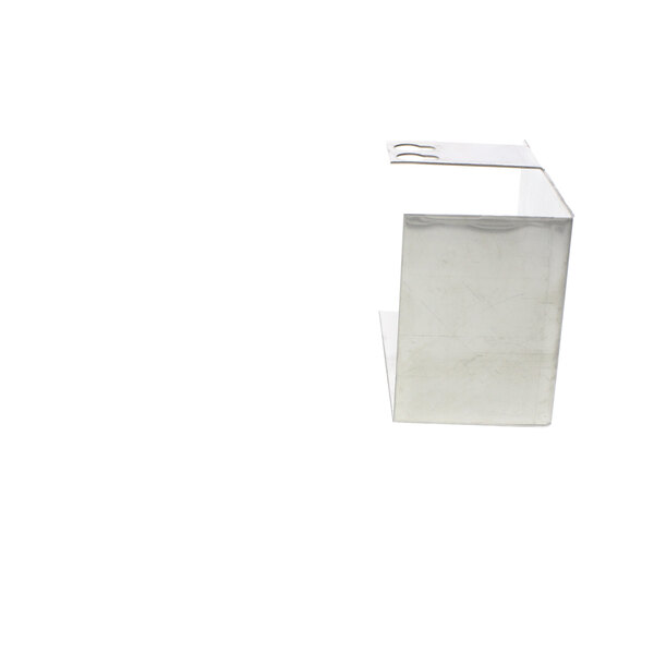 A white box with a US Range silver metal oven pilot shield inside.