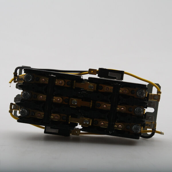 A close-up of a black and yellow Lang interlocking contactor.
