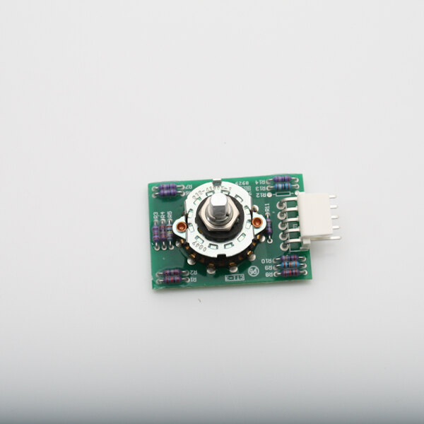 A close-up of a small green Lang temperature control circuit board.