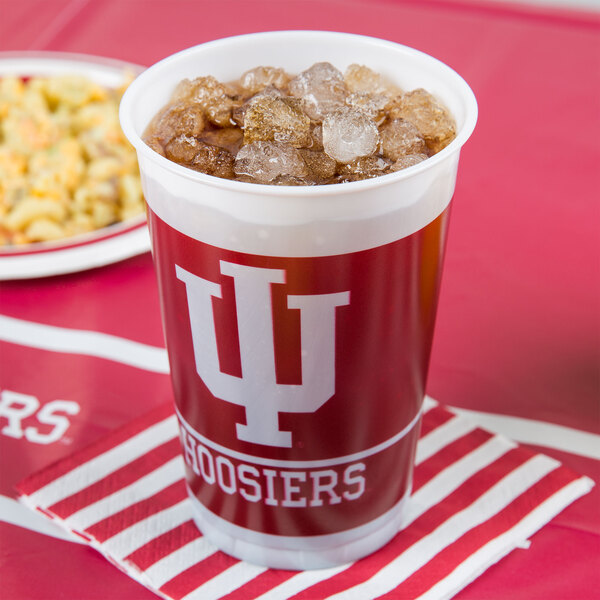 A Creative Converting Indiana University plastic cup filled with ice.