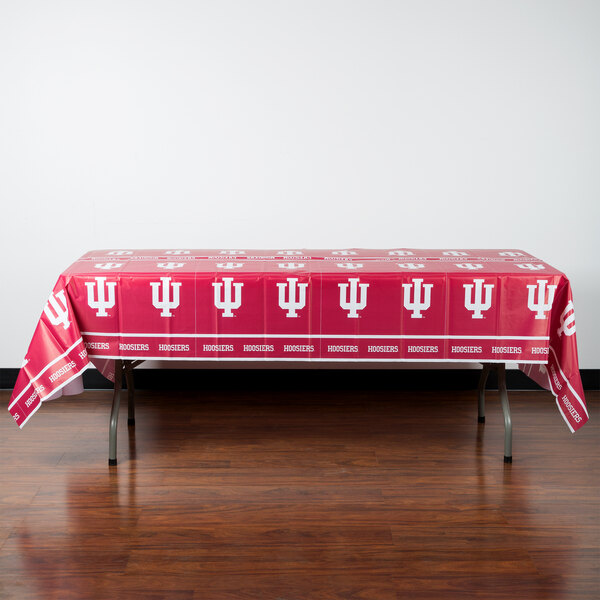 A red rectangular table with "Indiana University" in white text on it.