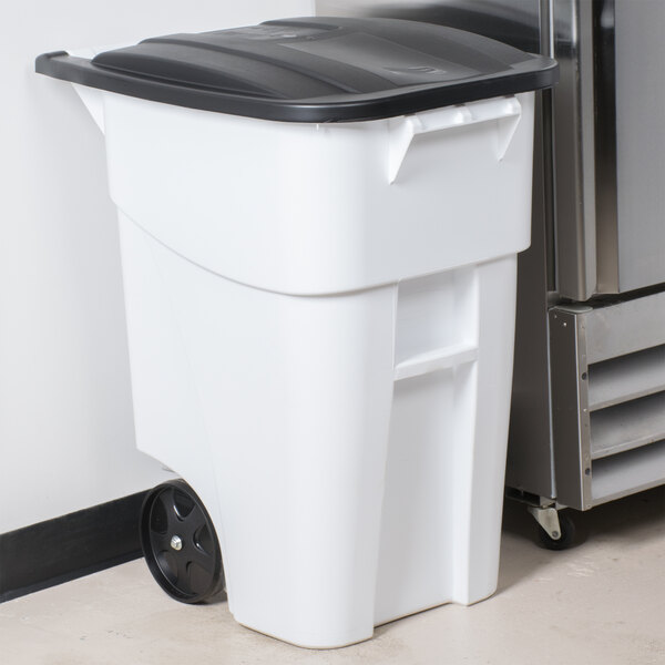A white Rubbermaid wheeled rectangular trash can with a black lid.