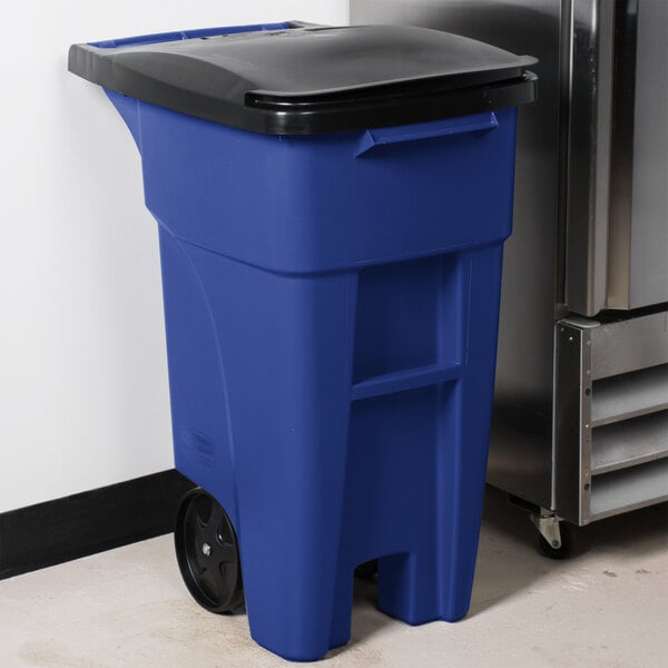 A blue Rubbermaid commercial trash can with a lid.