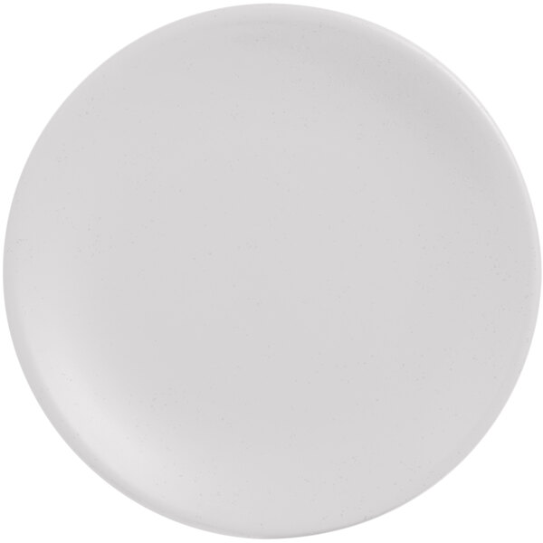 A white porcelain coupe plate with a speckled surface.