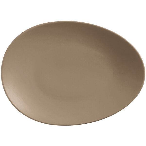 A close up of a Libbey Driftstone organic porcelain coupe plate with a brown rim.