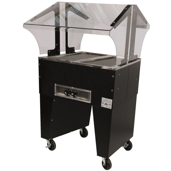 An Advance Tabco stainless steel hot food table with open wells on a counter.
