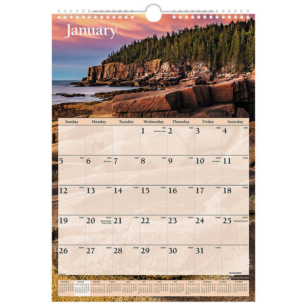 A At-A-Glance wall calendar with a scenic picture of a rocky beach.