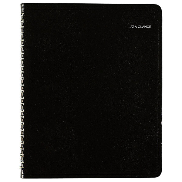 A black At-A-Glance weekly planner with a silver spiral binding.