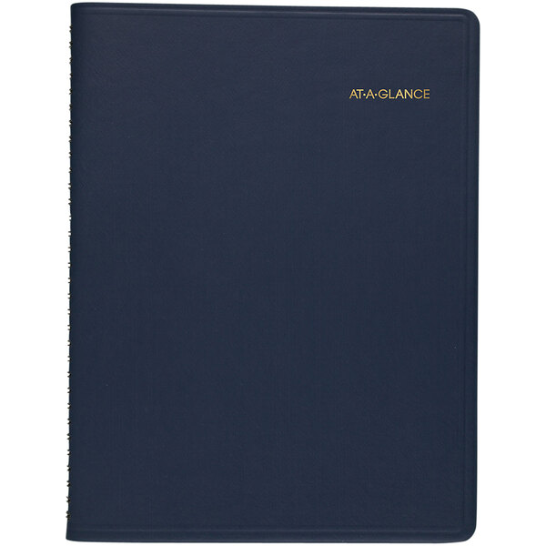 An At-A-Glance navy blue notebook with gold text that reads "January 2024 - January 2025"