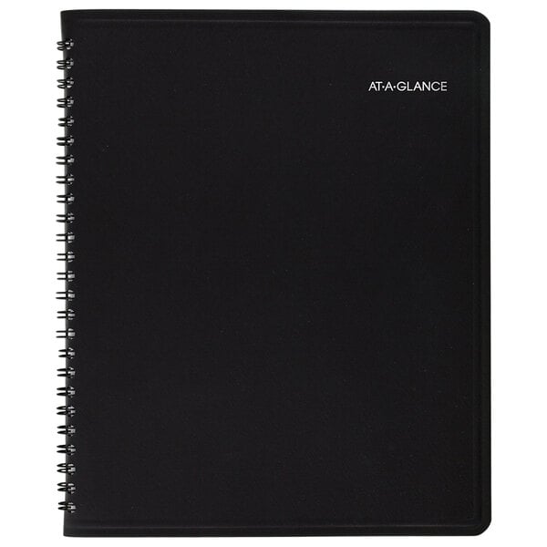 A black spiral At-A-Glance planner with white text that reads "2024 Monthly Planner"