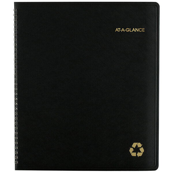 An At-A-Glance black recycled monthly planner with a recycle symbol on it.
