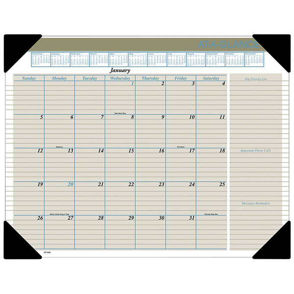 An At-A-Glance desk pad calendar with black numbers and a blue border on a white background.