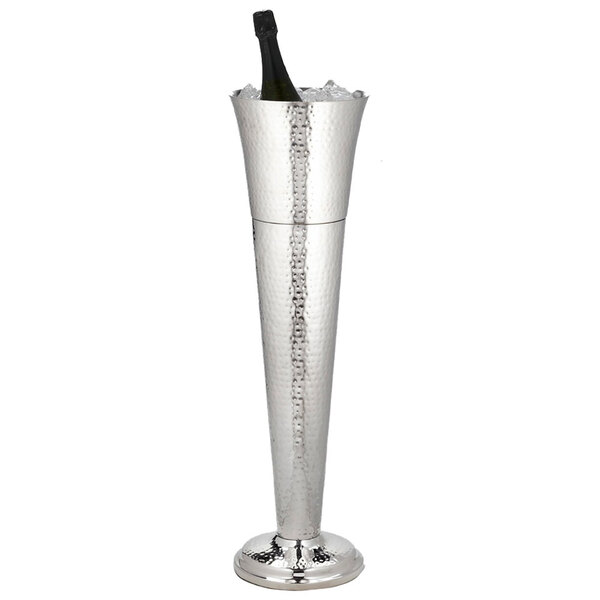 A silver American Metalcraft hammered stainless steel wine bucket holding a bottle of champagne.