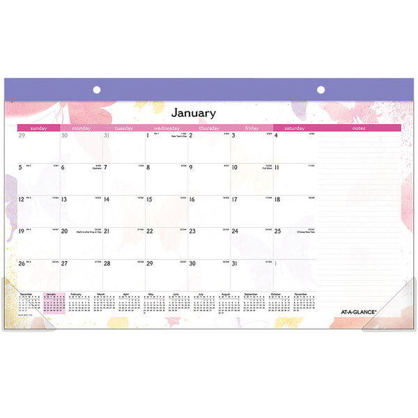 An At-A-Glance desk pad calendar with numbers and pink and purple flowers on a white background with a purple border.