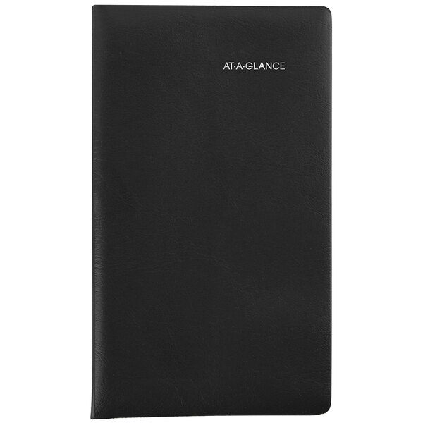 A black leather At-A-Glance pocket-size monthly planner with white text.