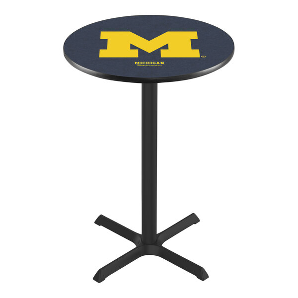 A round blue pub table with a yellow University of Michigan logo on top.