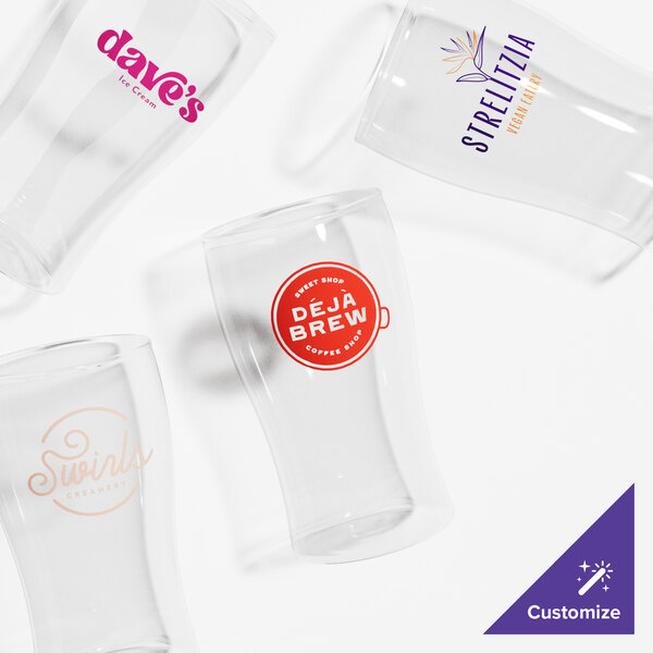 A set of four clear, customizable 5.5 oz. pub beer tasting glasses with various printed logos.