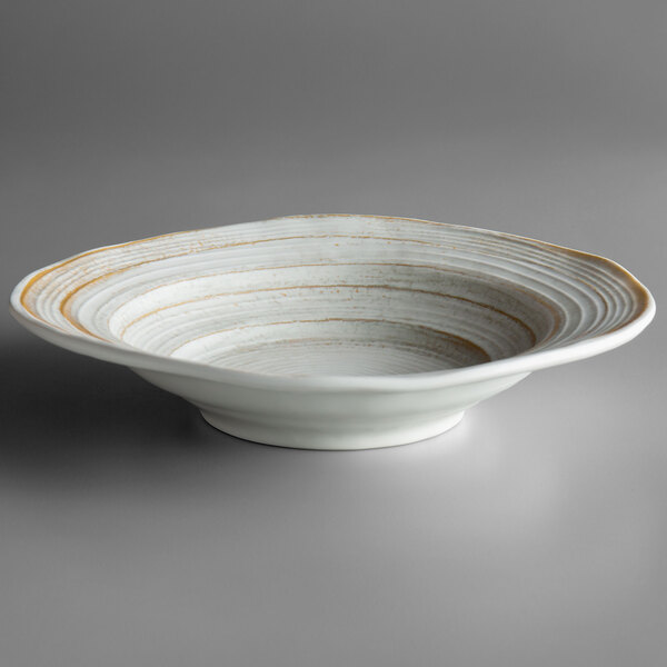 A white bowl with brown lines on it.