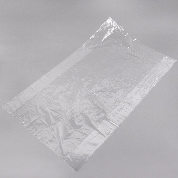 A roll of clear plastic Inteplast Group bun pan covers.