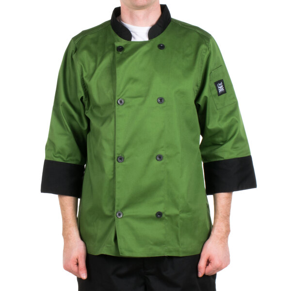 A man wearing a mint green Chef Revival chef jacket with black pants.