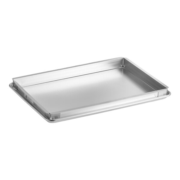 A rectangular metal sheet cake pan set with an extender, designed for baking.