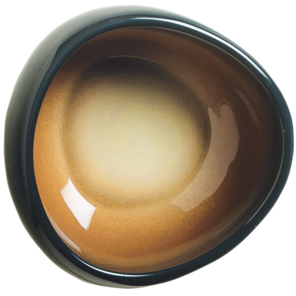 A white World Tableware porcelain dip dish with a brown and black rim.