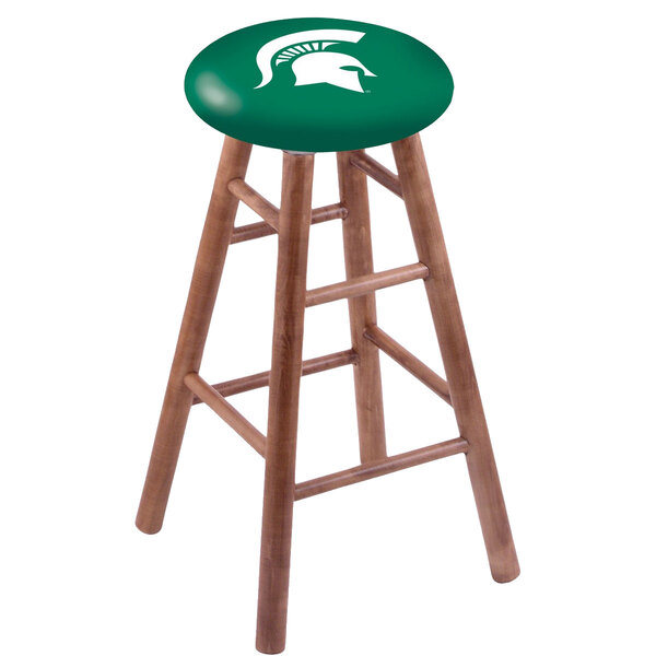 A wooden Holland Bar Stool with a green seat and Michigan State University logo on the seat.
