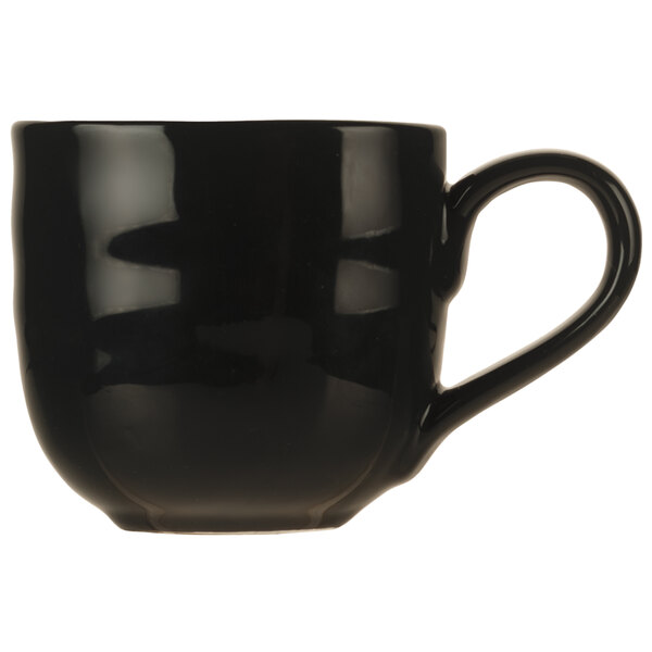 A black coffee mug with a black handle.