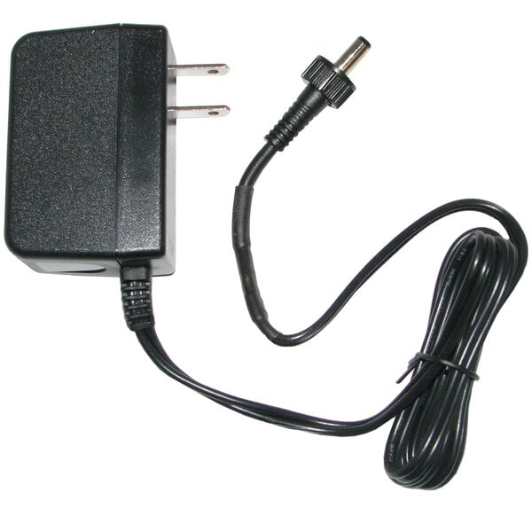 A black 6V AC adapter for a Bobrick automatic soap dispenser.