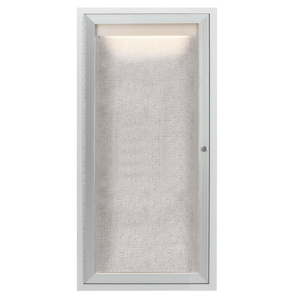 A white rectangular cabinet with a light on the inside.