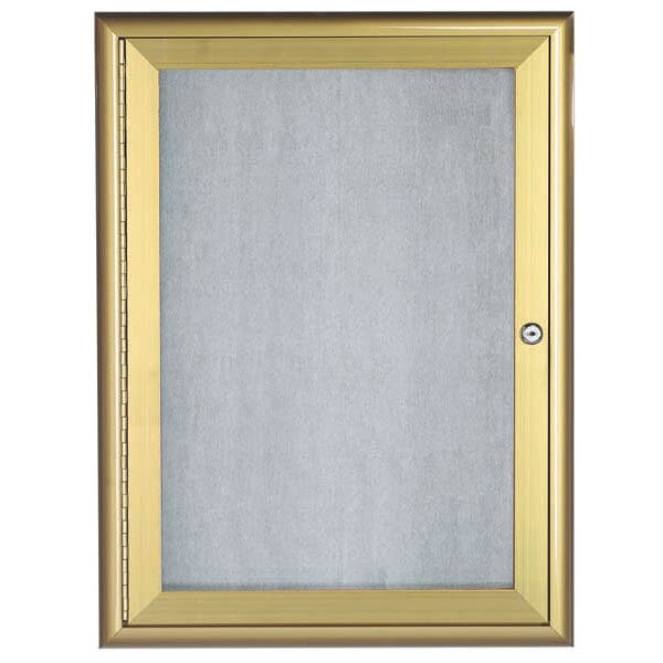 The glass door of a gold Aarco bulletin board with a black interior.