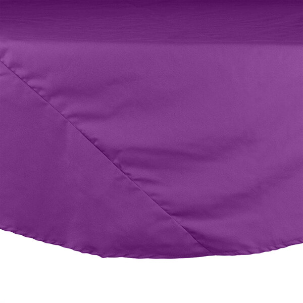 A purple Intedge round table cloth on a white surface.