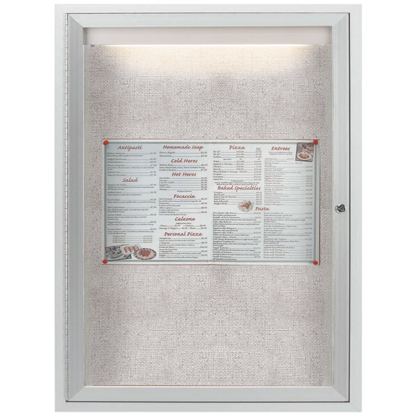 An Aarco silver enclosed bulletin board with a menu inside.