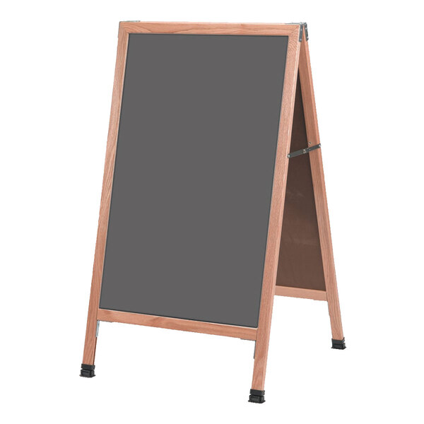 A wooden A-frame sign with a black chalk board.