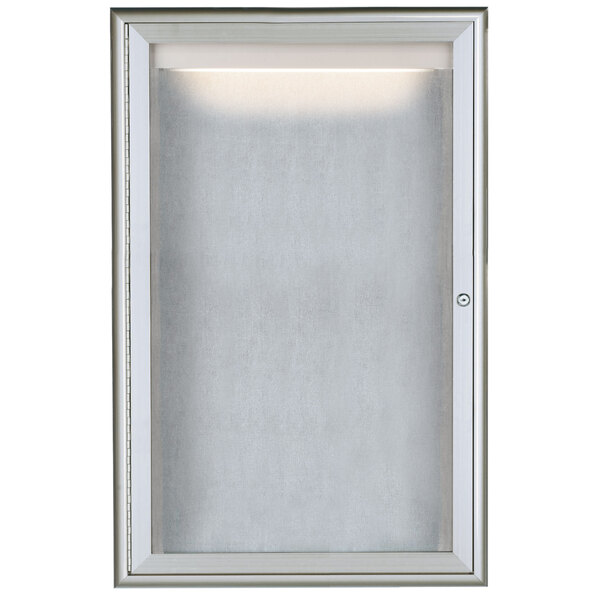 A white rectangular Aarco enclosed bulletin board with a white frame and LED lighting.