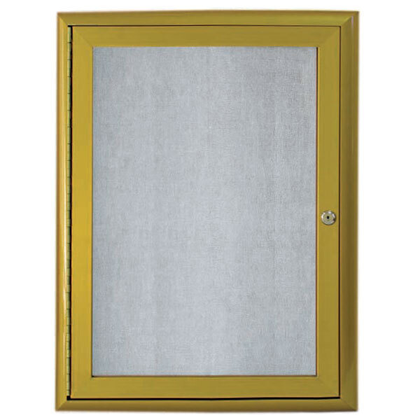 An Aarco enclosed bulletin board with a yellow metal frame and glass door.