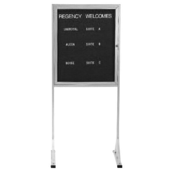 An Aarco enclosed black aluminum sign with white letter board text.
